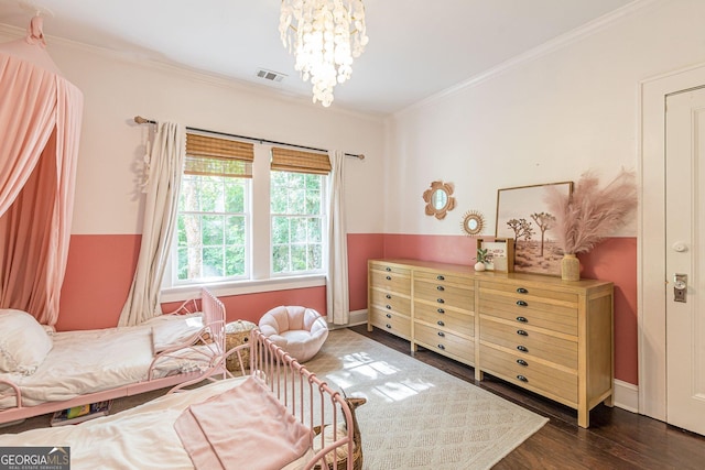 bedroom featuring dark hardwood / wood-style flooring, an inviting chandelier, and crown molding