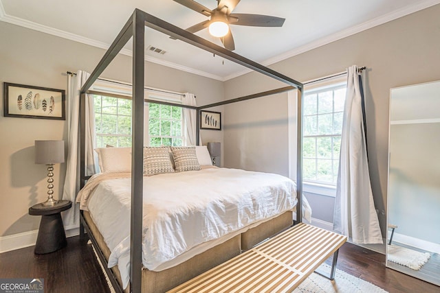 bedroom featuring ceiling fan, crown molding, and wood-type flooring