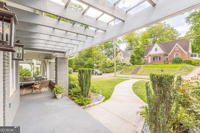 view of patio / terrace with covered porch and a pergola