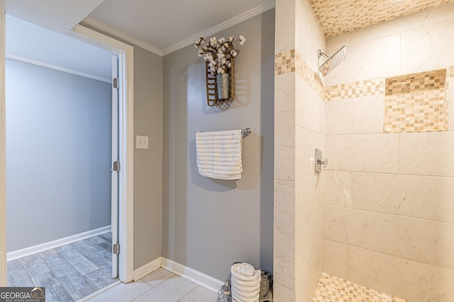 bathroom featuring hardwood / wood-style floors, crown molding, and walk in shower