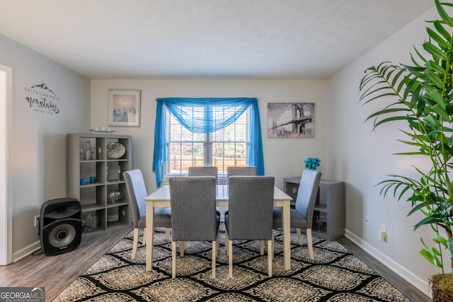 dining room with hardwood / wood-style floors