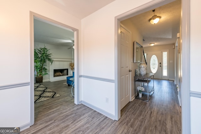 hallway featuring hardwood / wood-style flooring and a textured ceiling