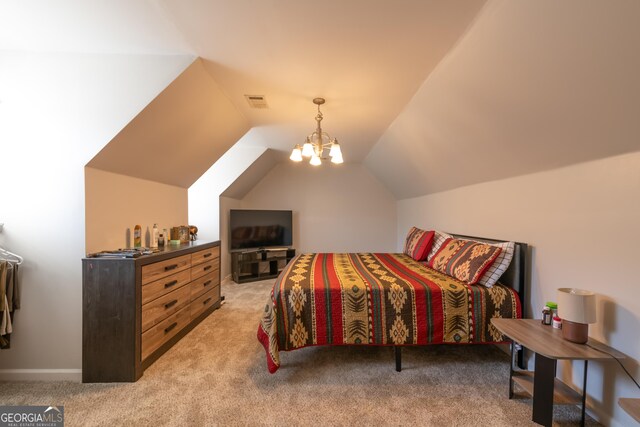 carpeted bedroom featuring lofted ceiling and an inviting chandelier