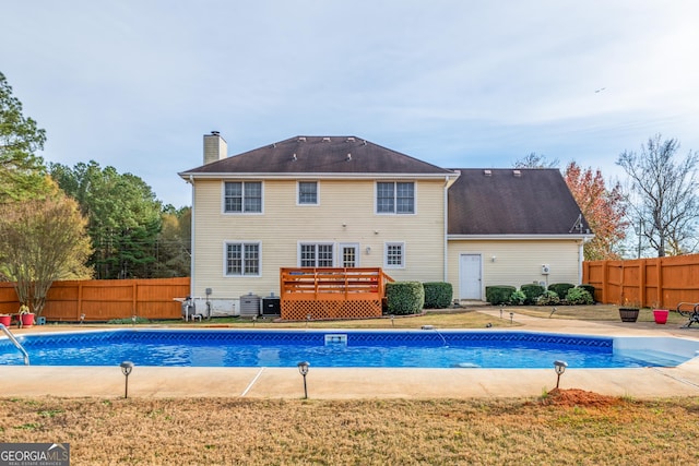 view of pool with a deck, a patio area, and central air condition unit