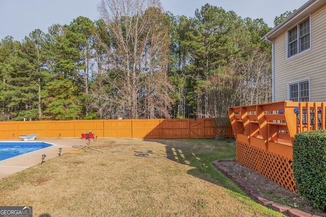 view of yard with a pool side deck