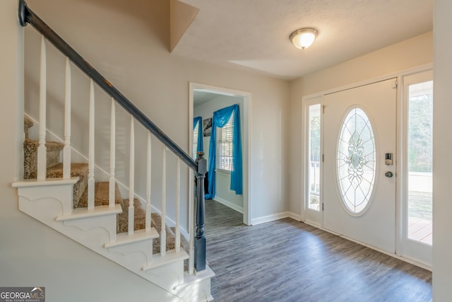 foyer entrance with hardwood / wood-style floors