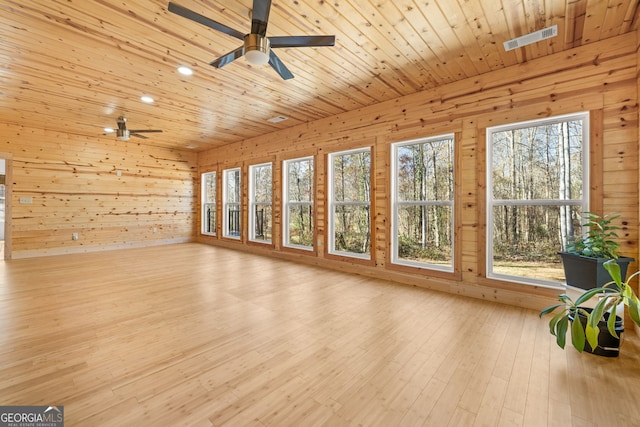 unfurnished sunroom with ceiling fan and wooden ceiling