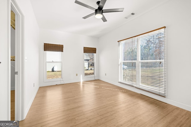 empty room featuring ceiling fan and light wood-type flooring