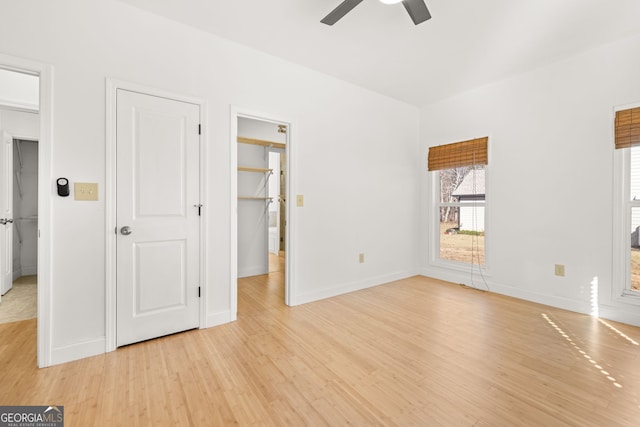 interior space with ceiling fan and light hardwood / wood-style floors