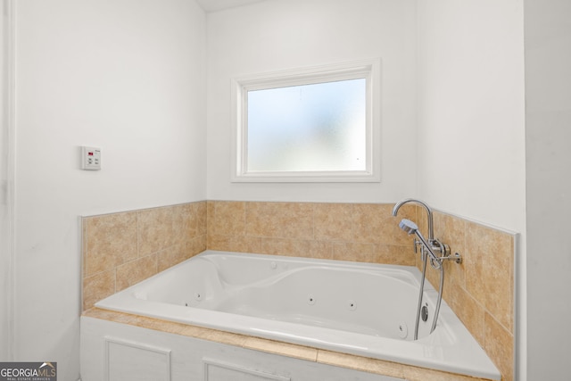 bathroom featuring tiled tub