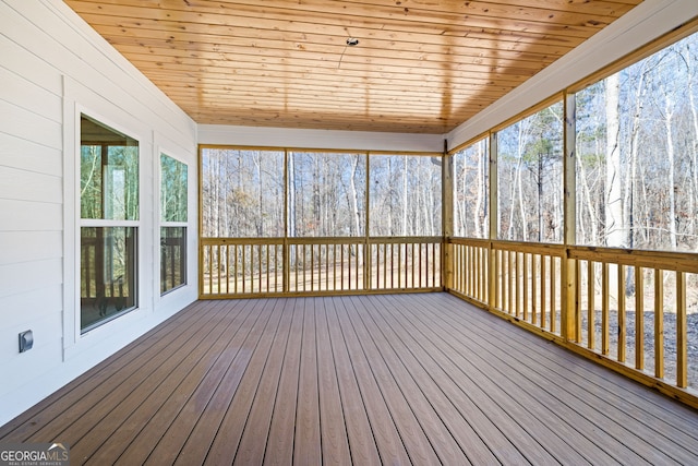 unfurnished sunroom with wood ceiling