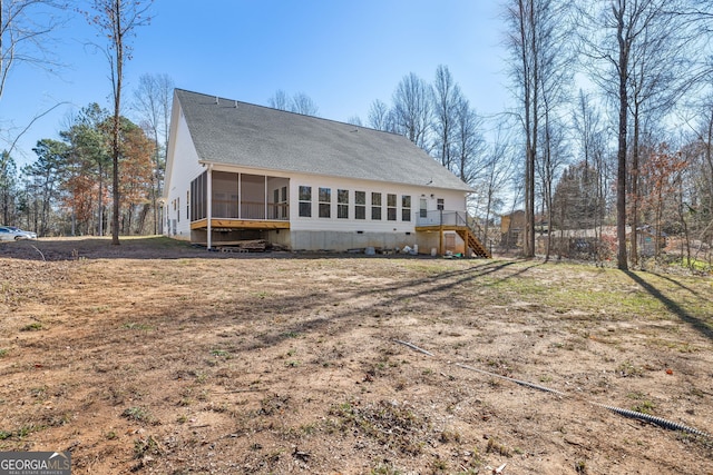 rear view of house with a sunroom