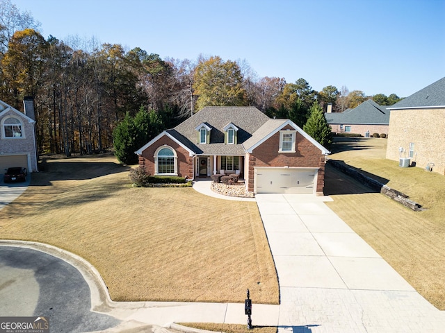 view of front of home featuring a front yard and a garage