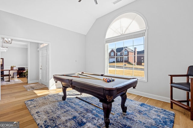 playroom with light hardwood / wood-style floors, vaulted ceiling, a notable chandelier, and billiards