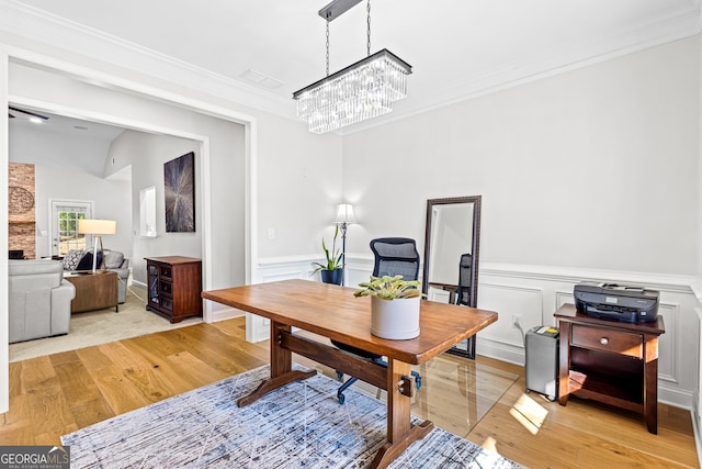 office area with a chandelier, light hardwood / wood-style flooring, and crown molding