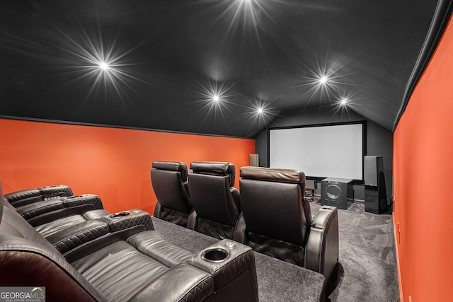 cinema room with carpet flooring and lofted ceiling