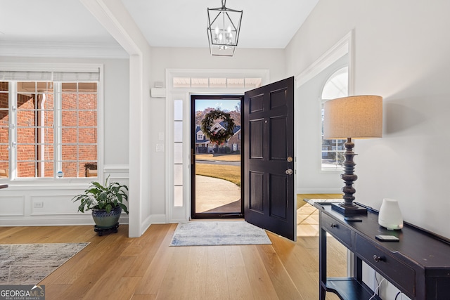 entrance foyer with light hardwood / wood-style flooring and a healthy amount of sunlight