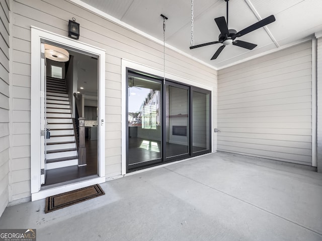 exterior space featuring a ceiling fan