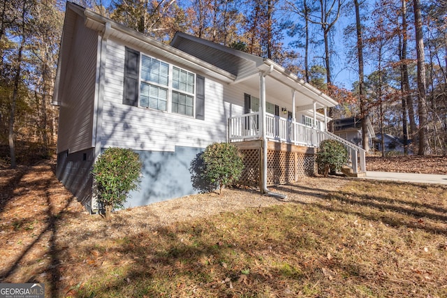 view of front of house with a front lawn and a porch