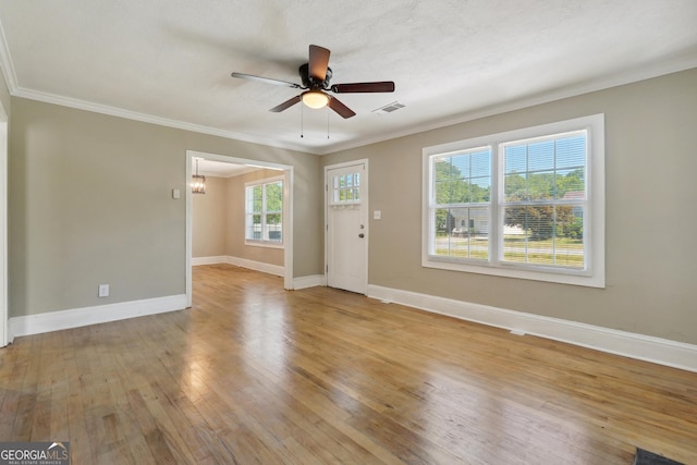 unfurnished living room with a textured ceiling, ceiling fan with notable chandelier, light hardwood / wood-style floors, and crown molding