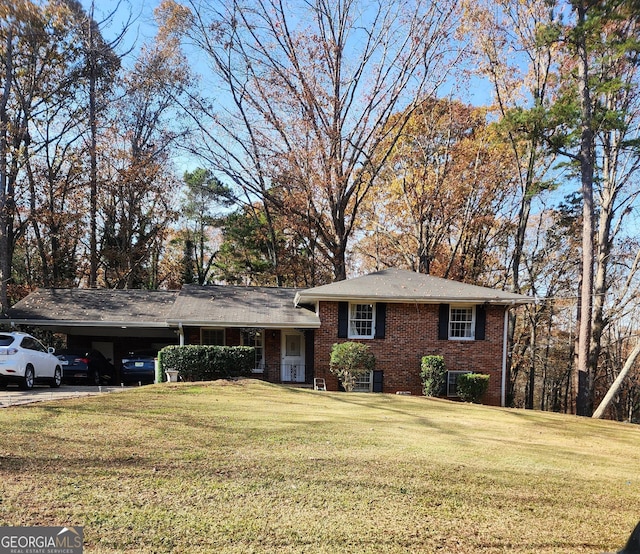 view of front of house with a front yard and a carport