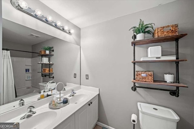 full bathroom featuring vanity, shower / bath combo, and toilet