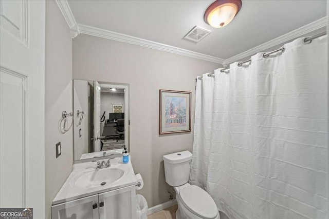 bathroom with vanity, toilet, and ornamental molding