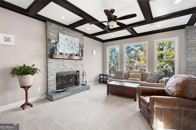 living room with light carpet, a fireplace, and coffered ceiling