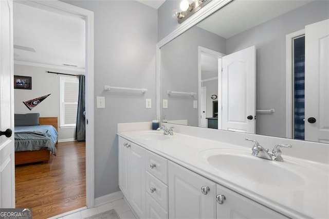 bathroom featuring hardwood / wood-style floors and vanity