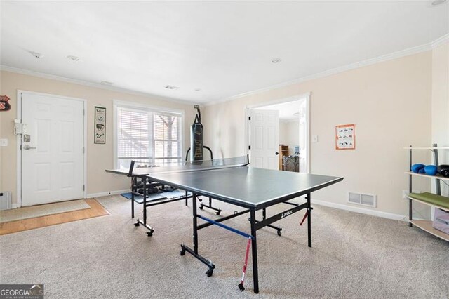 playroom with light colored carpet and crown molding