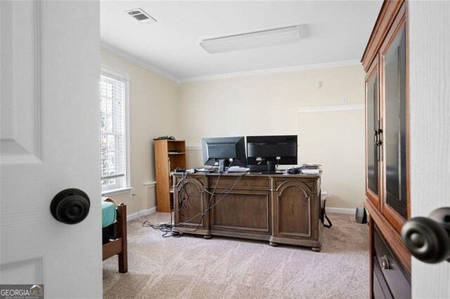 carpeted office with a healthy amount of sunlight and crown molding