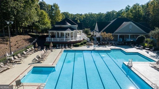 view of swimming pool featuring a patio area