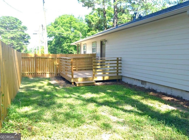 view of yard with a wooden deck