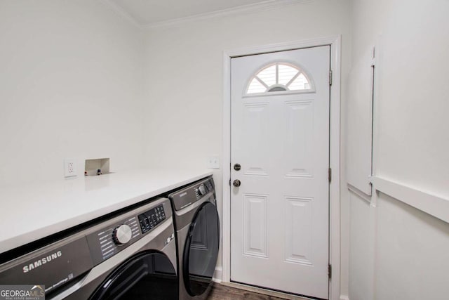 laundry area featuring separate washer and dryer, crown molding, and dark hardwood / wood-style flooring