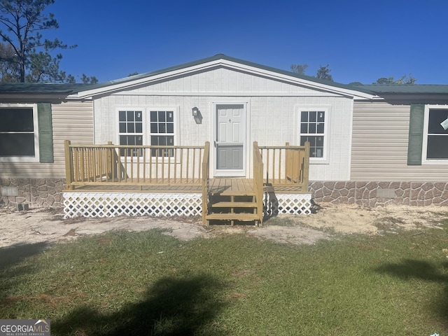 exterior space with a yard and a deck