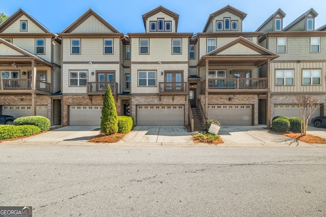 townhome / multi-family property with concrete driveway and a garage