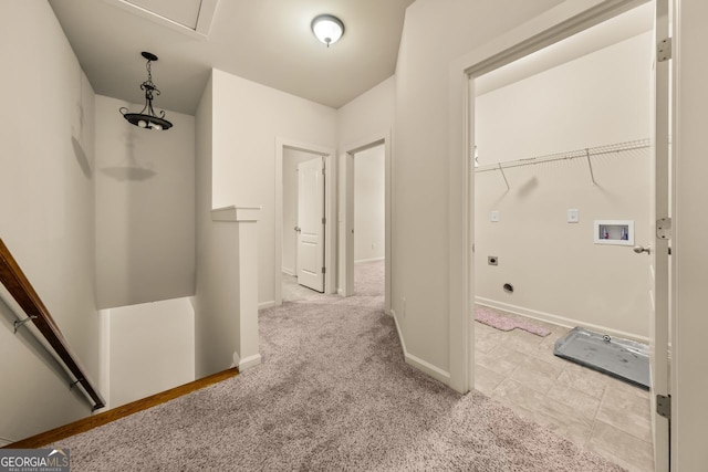 hall featuring light carpet and baseboards