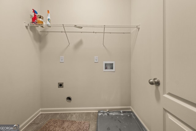 laundry room with washer hookup, laundry area, baseboards, and electric dryer hookup