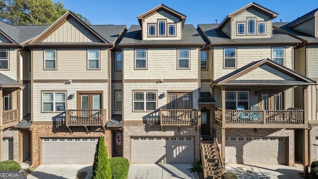 view of property with an attached garage and driveway