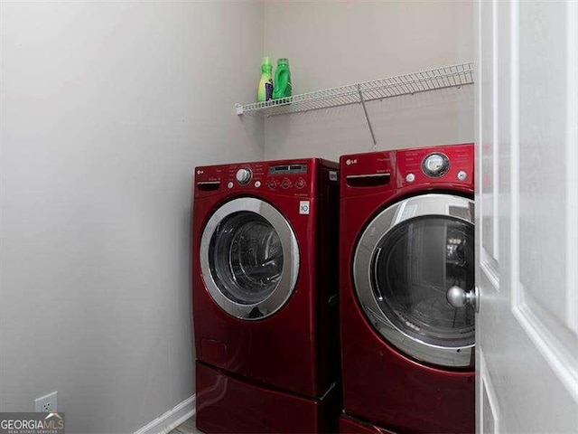 clothes washing area featuring washing machine and dryer