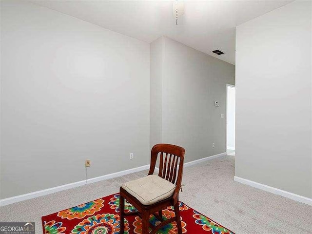 sitting room featuring carpet flooring