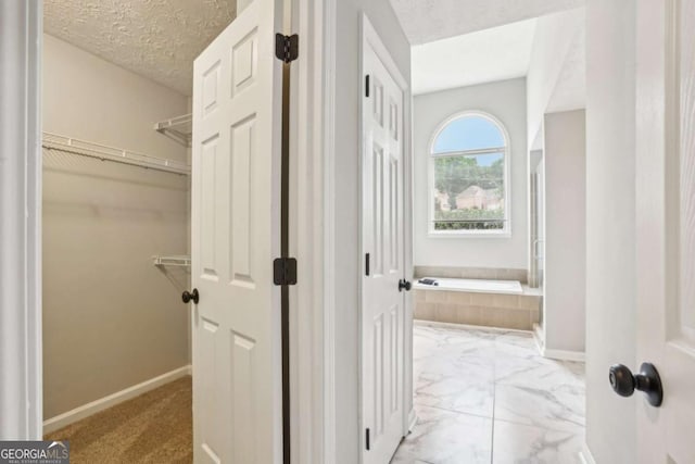 interior space featuring a textured ceiling