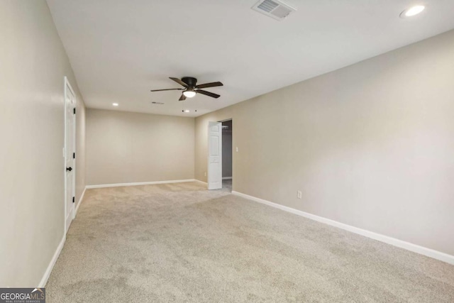 empty room with light carpet and ceiling fan