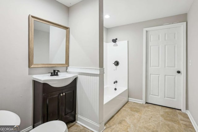 full bathroom with vanity, shower / bathtub combination, and toilet