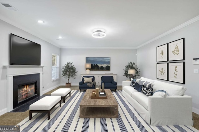 living room with ornamental molding