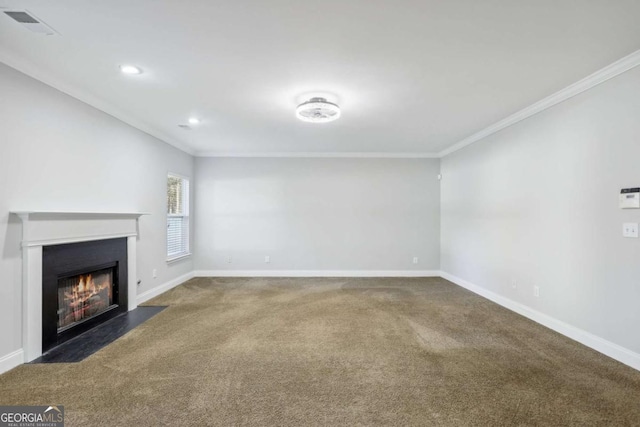 unfurnished living room featuring ornamental molding and dark colored carpet