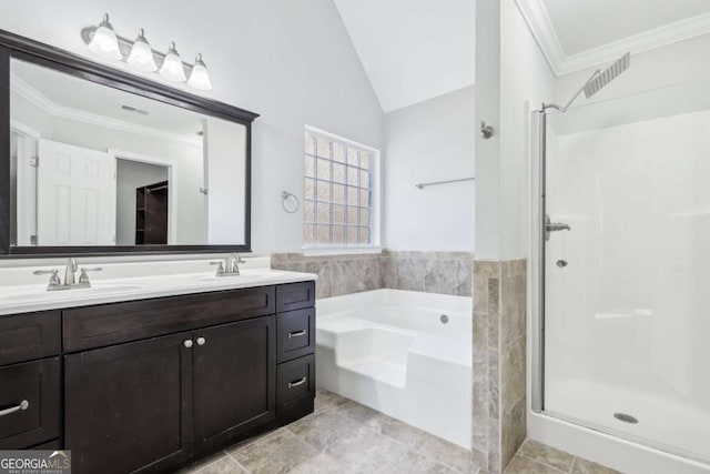 bathroom featuring vanity, shower with separate bathtub, and vaulted ceiling