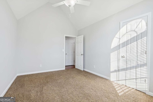 unfurnished bedroom with lofted ceiling, ceiling fan, and carpet flooring