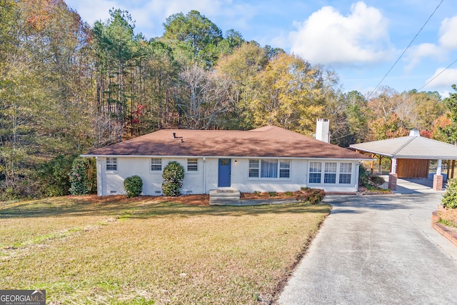 single story home featuring a front yard and a carport