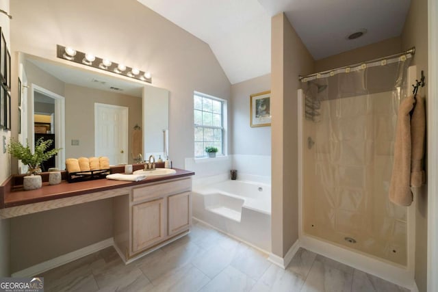 bathroom featuring vanity, lofted ceiling, and independent shower and bath